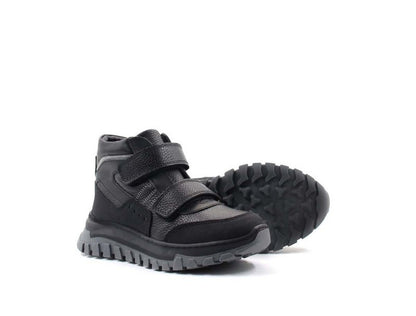 Pair of black and gray children's boots with velcro straps on a white background