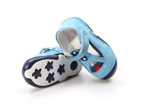 Pair of blue children's shoes with star patterns on a white background