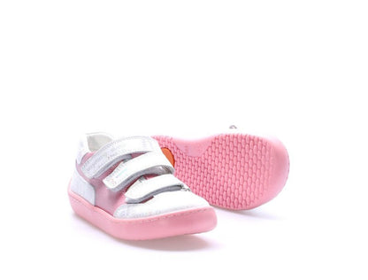 Pink and white children's shoe on a white background