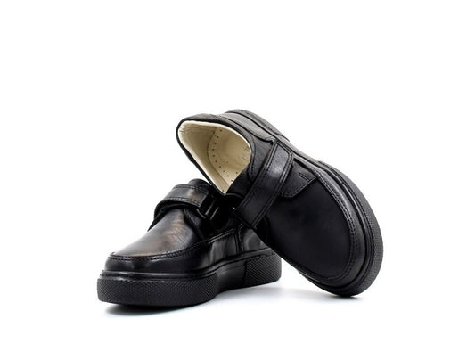 Pair of black shoes on a white background